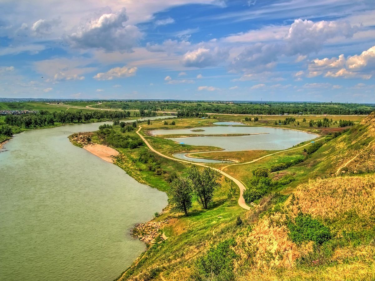 The Bow River and a pond in Fish Creek Provincial Park in southeast Calgary, near Cranston.